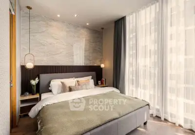 Luxurious bedroom with elegant decor and large window for natural light