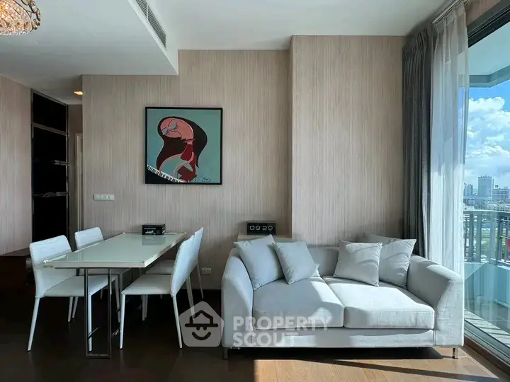 Modern living room with elegant decor and city view, featuring a cozy sofa and dining area.