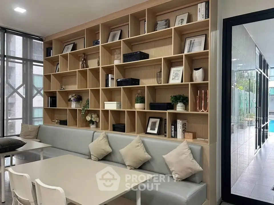 Modern living room with stylish shelving and cozy seating area