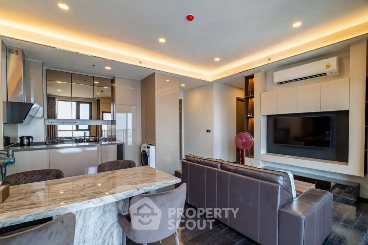 Luxurious open-plan living room with modern kitchen and elegant dining area