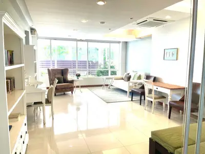 Spacious and bright living room with modern furniture and large windows