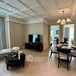 Elegant living room with modern furniture and dining area in luxury apartment