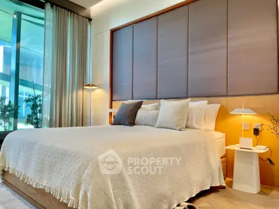 Luxurious modern bedroom with elegant decor and large window view