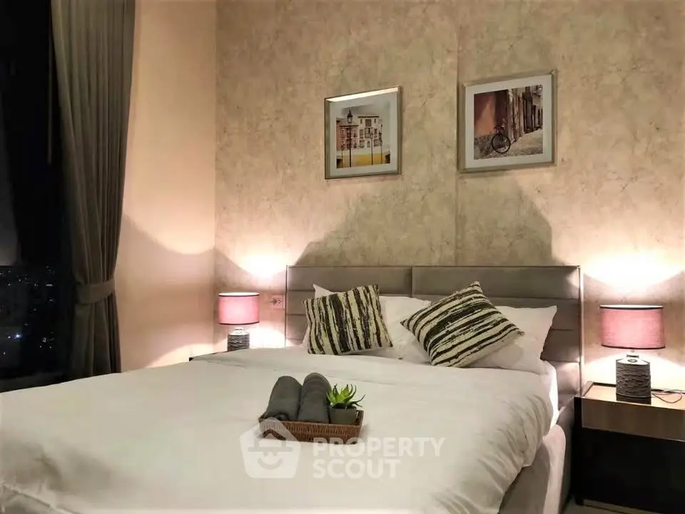 Elegant bedroom with cozy lighting and stylish decor in modern apartment.