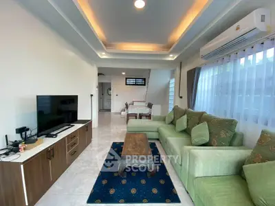 Spacious living room with modern decor and cozy seating area