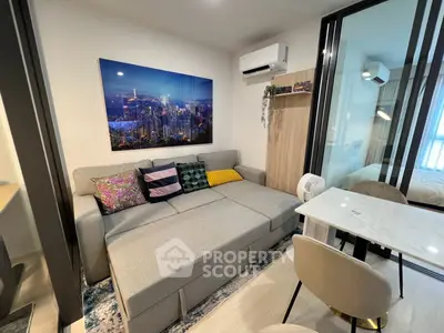 Modern living room with stylish decor and cozy seating in a contemporary apartment.