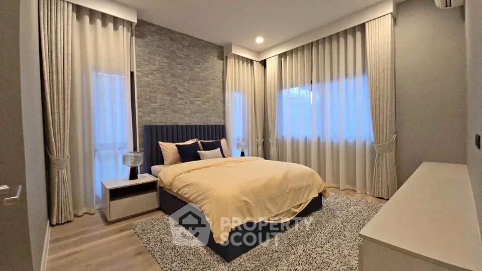 Luxurious bedroom with elegant decor and soft lighting, perfect for relaxation.