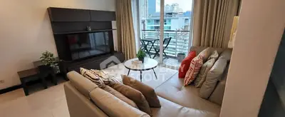 Modern living room with balcony view in high-rise apartment