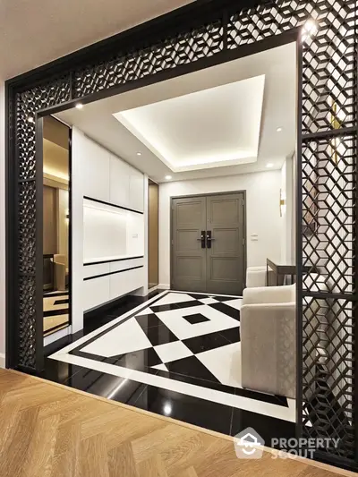 Elegant modern entrance with geometric floor design and stylish decor