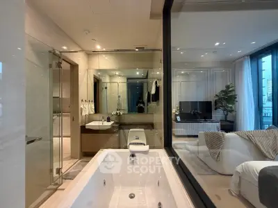 Luxurious modern bathroom with glass wall overlooking elegant living room