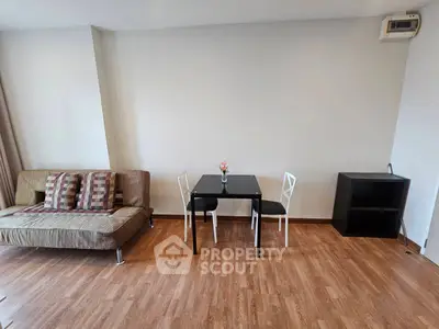Modern living room with sleek furniture and wooden flooring