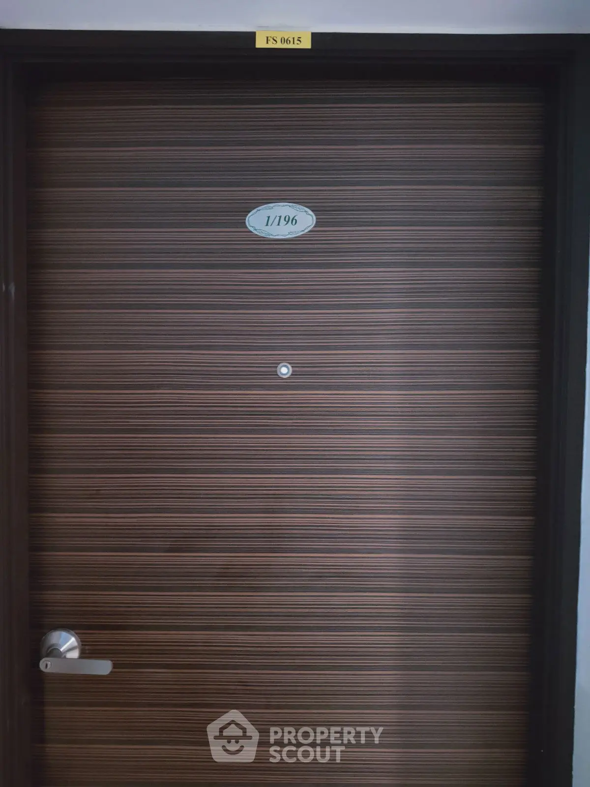 Modern apartment door with sleek design and room number plaque
