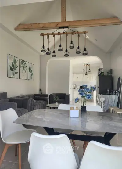 Modern open-plan living room with stylish dining area and elegant decor