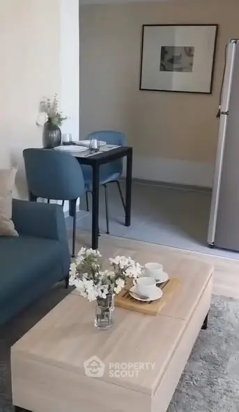 Cozy living room with modern decor and dining area in open layout