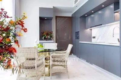 Modern kitchen with sleek cabinetry and elegant dining area