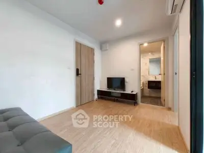 Modern living room with wooden flooring and minimalist decor