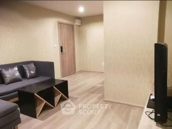 Modern living room with stylish furniture and wooden flooring