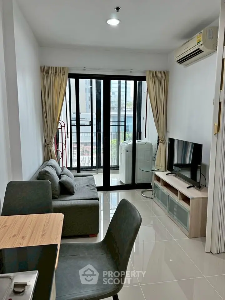 Modern living room with balcony view in urban apartment