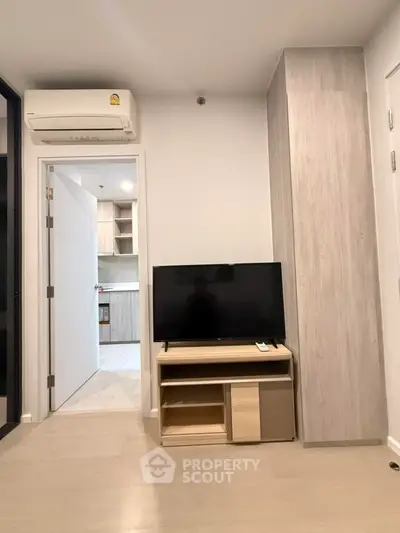 Modern living room with TV and air conditioning in a stylish apartment