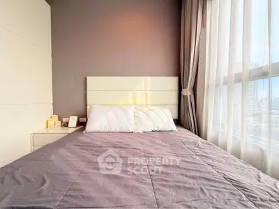 Modern bedroom with large window and stylish decor