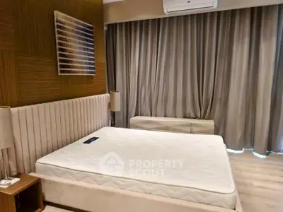 Modern bedroom with elegant decor and large window curtains