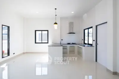 Spacious modern kitchen with sleek design and ample natural light