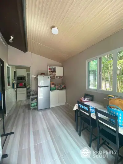 Charming kitchen with modern appliances and natural light, perfect for family gatherings.