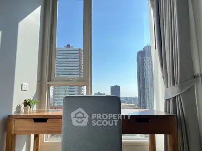 Bright study area with desk and city view through large window