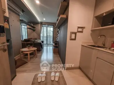 Modern apartment interior with cozy living room and compact kitchen