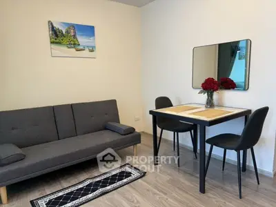Cozy living room with modern furniture and elegant decor, perfect for relaxation and dining.