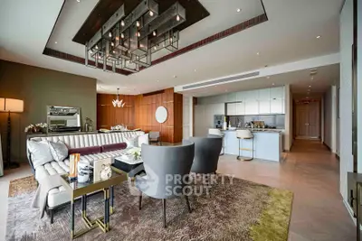 Luxurious open-plan living room with modern decor and elegant lighting
