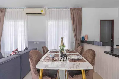 Stylish dining area with elegant decor and modern furniture in a cozy living space.