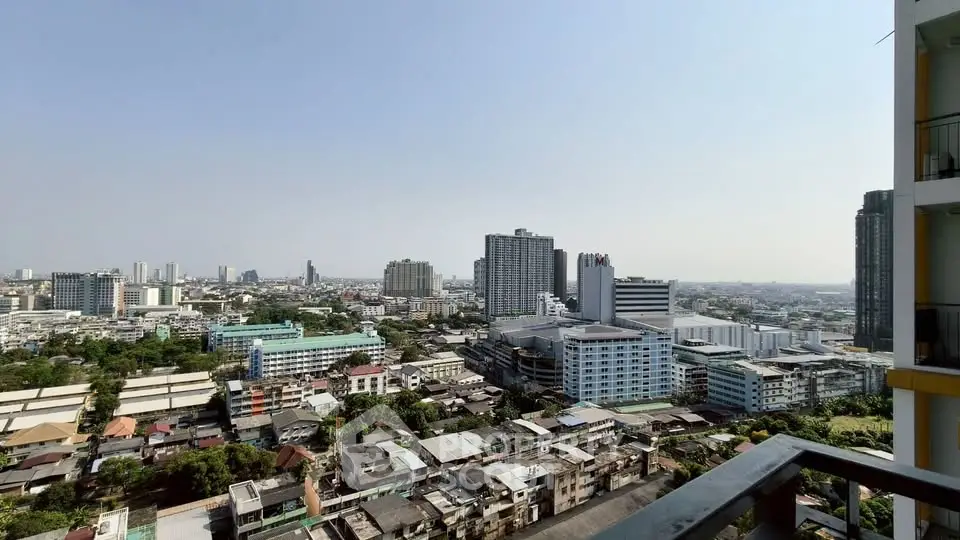 Stunning cityscape view from a high-rise balcony showcasing urban skyline and distant horizon.