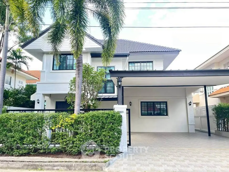 Stunning two-story house with modern design and spacious driveway in a serene neighborhood.