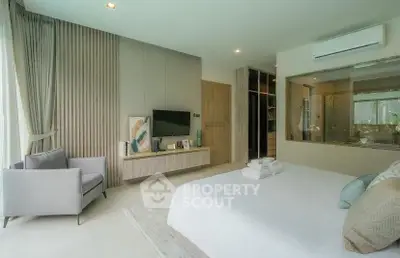 Luxurious bedroom with modern decor, large window, and stylish furnishings in a serene setting.