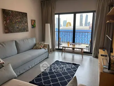 Modern living room with large window and city view, featuring stylish furniture and decor.