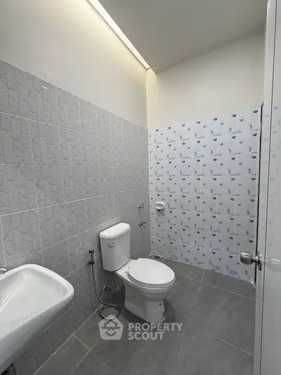 Modern bathroom with sleek tiles and contemporary fixtures