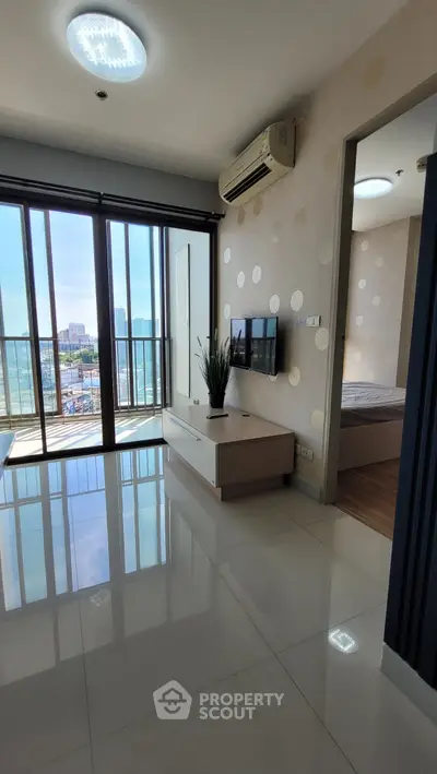 Modern apartment interior with balcony view and sleek design