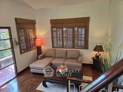 Charming living room with cozy sectional sofa and elegant decor, perfect for relaxation and entertaining.