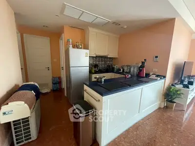 Charming kitchen with modern appliances and cozy open layout in a stylish apartment.