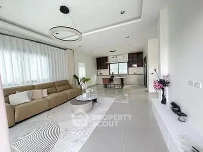 Spacious modern living room with open kitchen and elegant decor
