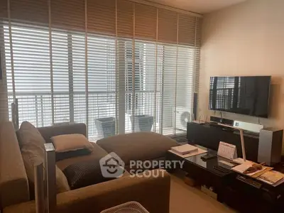 Modern living room with large windows and stylish furniture