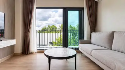 Modern living room with large window and balcony view