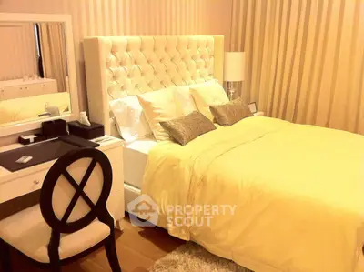 Luxurious bedroom with elegant decor and plush bedding in a modern apartment.