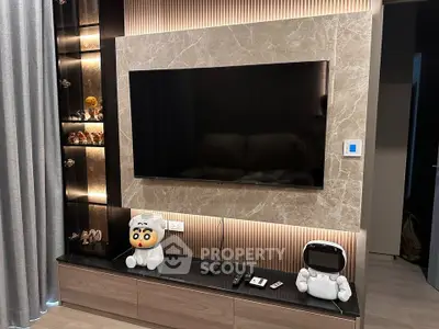 Modern living room with stylish TV setup and decorative shelving