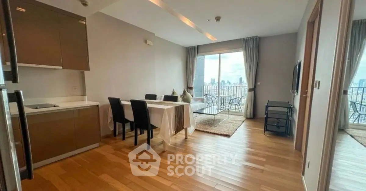 Spacious modern living room with dining area and city view balcony