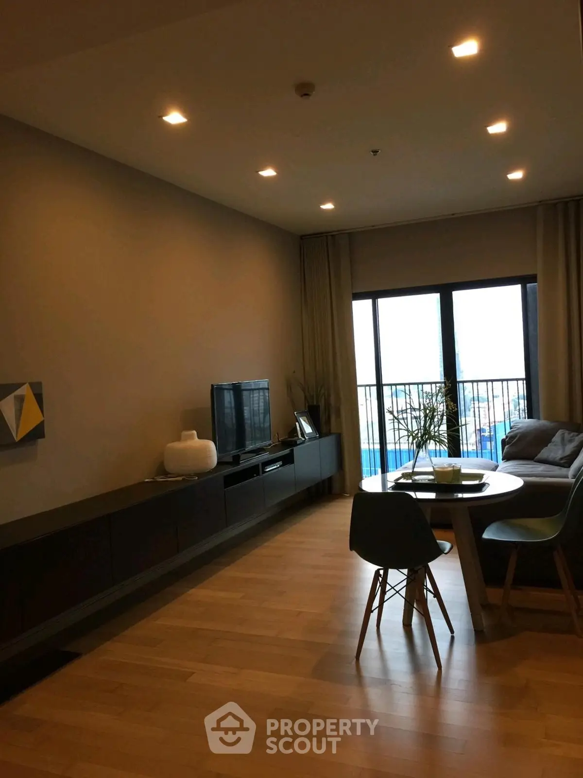 Modern living room with stylish furniture and large window view