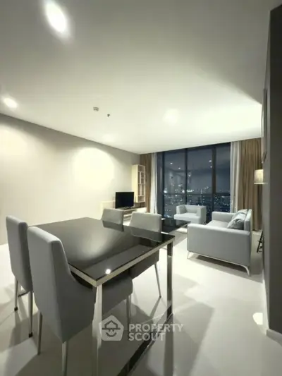 Modern living room with city view, sleek furniture, and ambient lighting