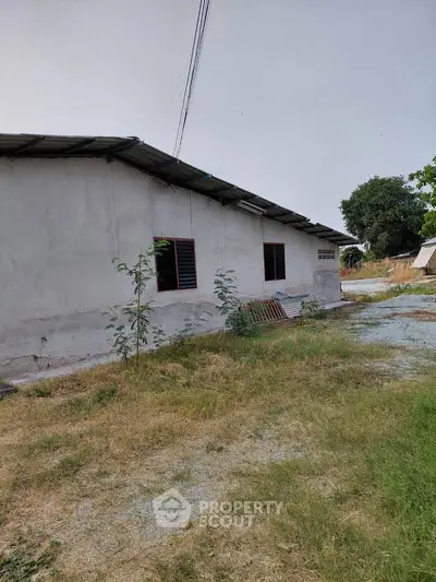 Explore this rustic single-story home with spacious outdoor area, perfect for renovation or development opportunities.