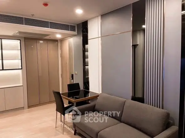 Modern living room with sleek furniture and stylish decor in a contemporary apartment.